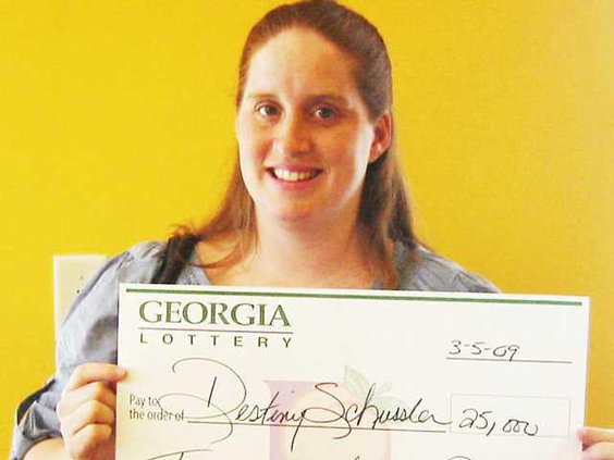 0320 Woman wins lotto