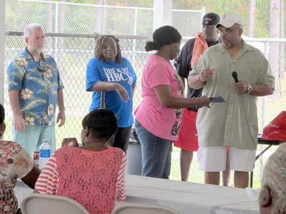 Theotis Jackson Veolia presenting award to Erma Washington with Gregg Higgins Jennie Worthy OMI watching