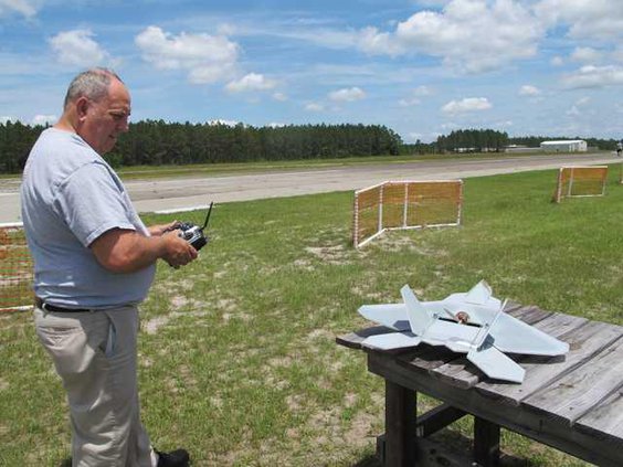 Club prez Lew Watdrop with model F-22