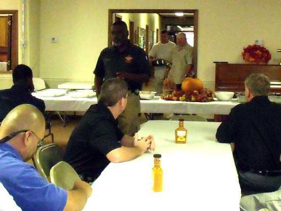 Chaplain Herman Scott speaks at luncheon