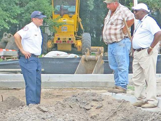 HFD Capt. Chris Moss with AD Williams Construction Company workers