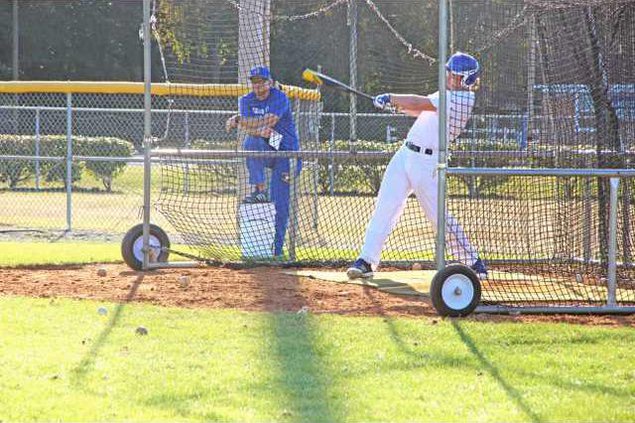 TigerCoachJeffPolkWatchesNewTransferWesBrooksMakeTheHitsAtPractice