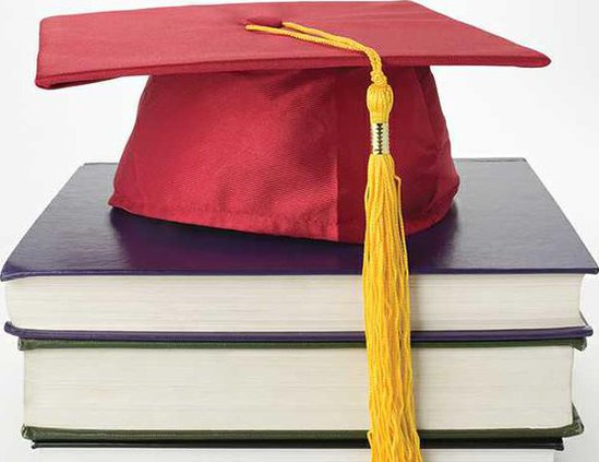 grad hat on books