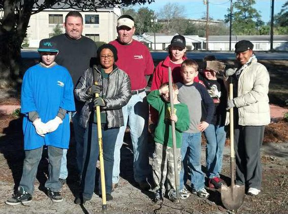 0127 Citizens of Georgia Power Company plant perrenials in Memorial Garden for Eric Leach