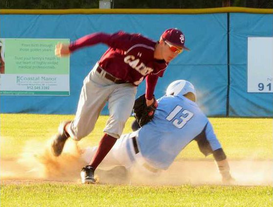 13 Luke Golden slides into first against the Cadets.