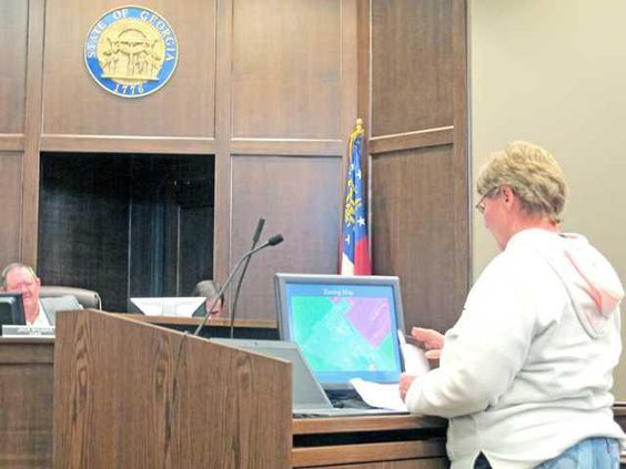 Neighbor Rhonda Durney who is opposition to the borrow pit tells planning commissioners that she thinks that pit is operating illegally