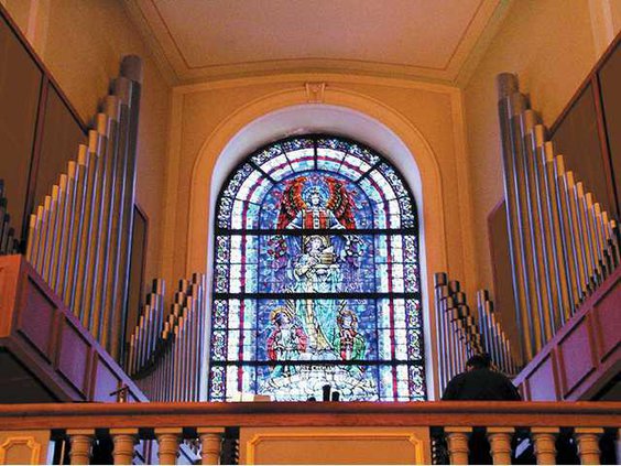 stained glass behind pulpit