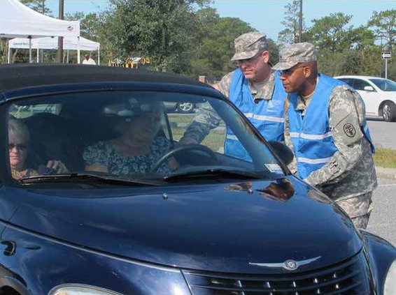 Maj. Mark Potter and Sfc. Luis Rivera OIC and NCOIC of drive-thru flu clinic