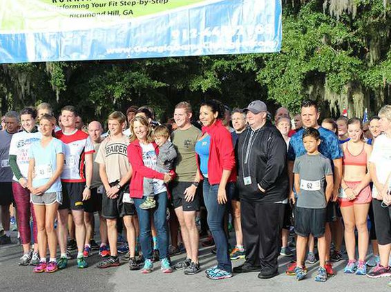Lisa Freeman smiles amongst the 5K runners before the race begins