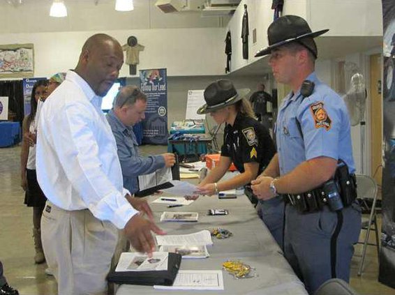 veterans asking questions at Dept. of Public Safety table