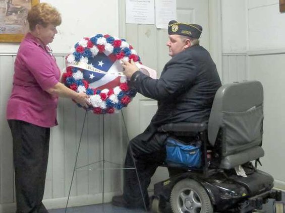 Schneider and Helmick placing wreath