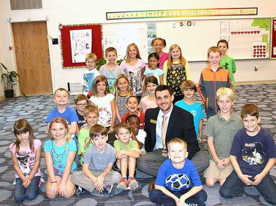 Miller takes a moment to pose with Ms. Kanickis 2nd Grade Class at MES. Photo by Evelyn Fallon