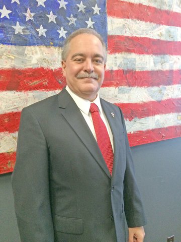 In re-election bid, Woods applauds literacy coaches