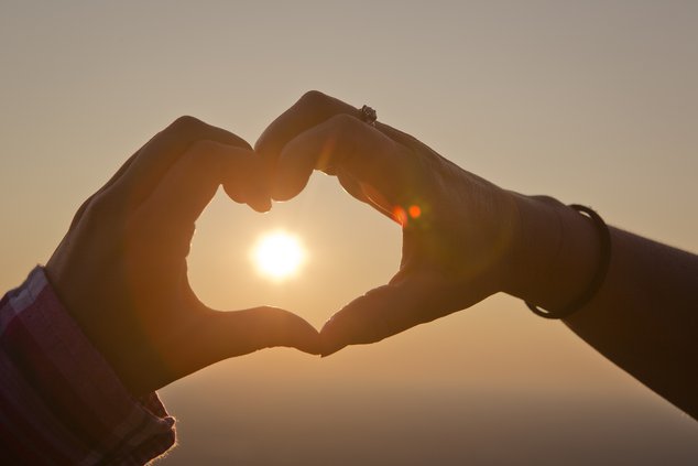 Heart hands sunset