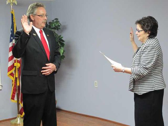 Re-elected mayor Thomas Hines is sworn in Monday eveing by Liberty County Probate Judge Nancy Aspinwall