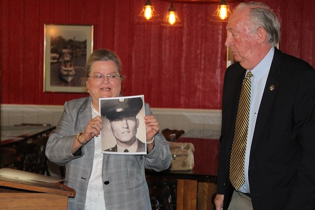 William Edward Sapp’s sister Kathy Lyons shows his service photo.