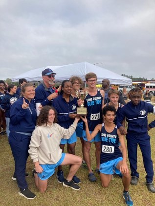 The Long County boys cross country team celebrates its region championship