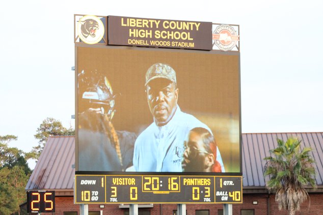Coach Kirk Warner is shown on the video board
