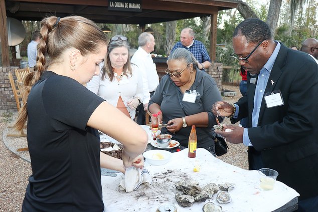 Joe Ford digs into the oysters.