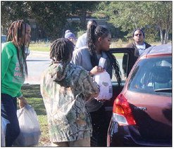 Local organizations join Manna House for turkey giveaway