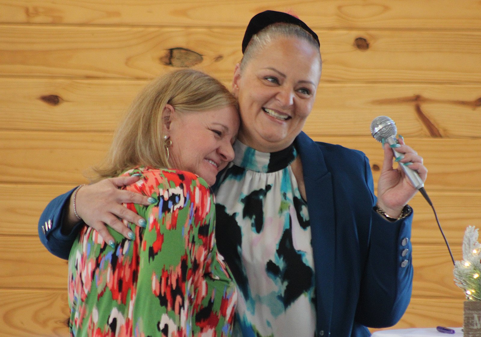 Out going president Jessica Victoria gets a hug from Andrea Powell.