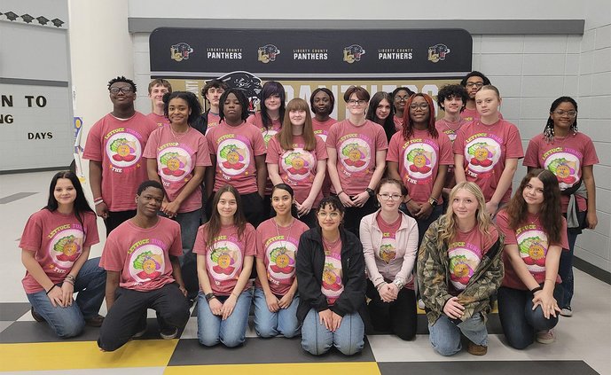 Liberty County High School FFA members show off their chapter shirts.